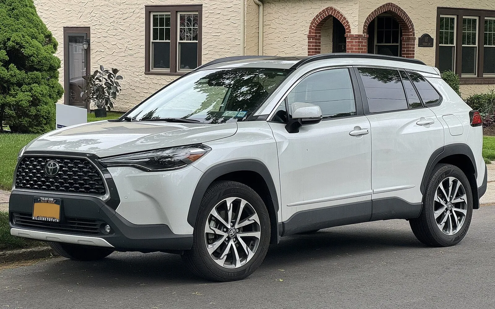 2023 Toyota Corolla Cross XLE in white, front three-quarter view