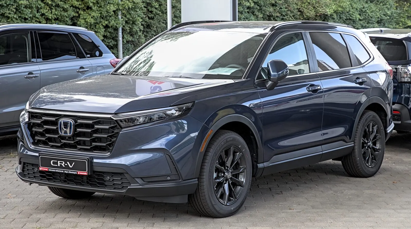 Dark blue sixth-generation Honda CR-V hybrid, front three-quarter view