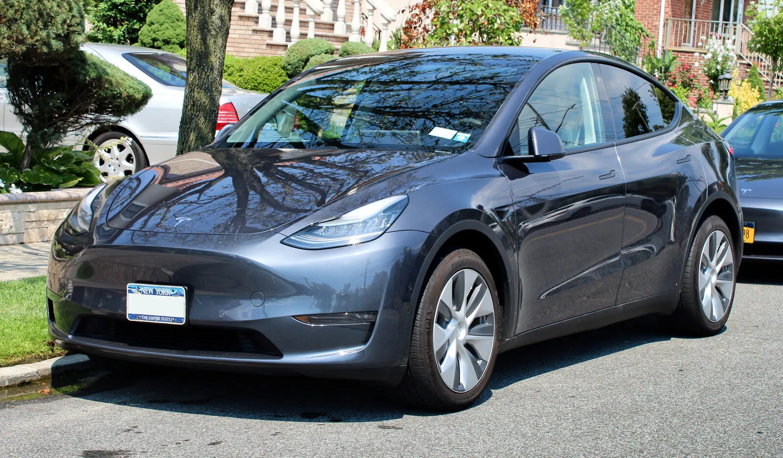 Tesla Model Y in dark grey, front three-quarter view