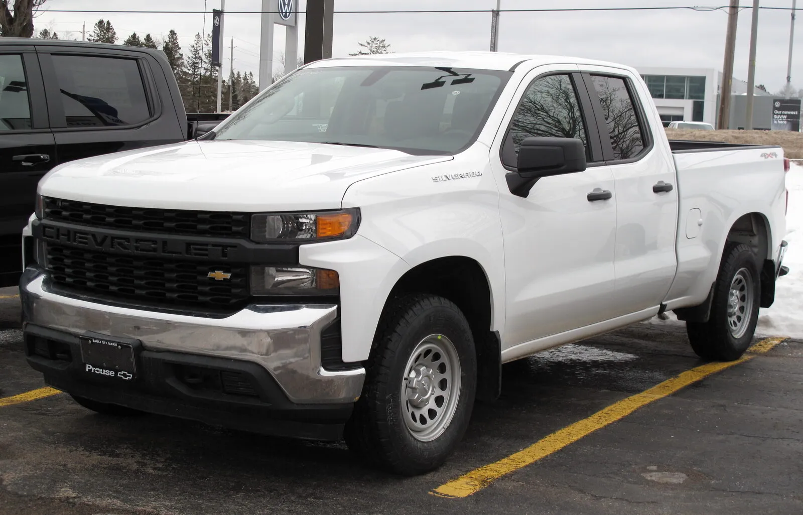 Chevrolet Silverado 1500 WT in white, front three-quarter view