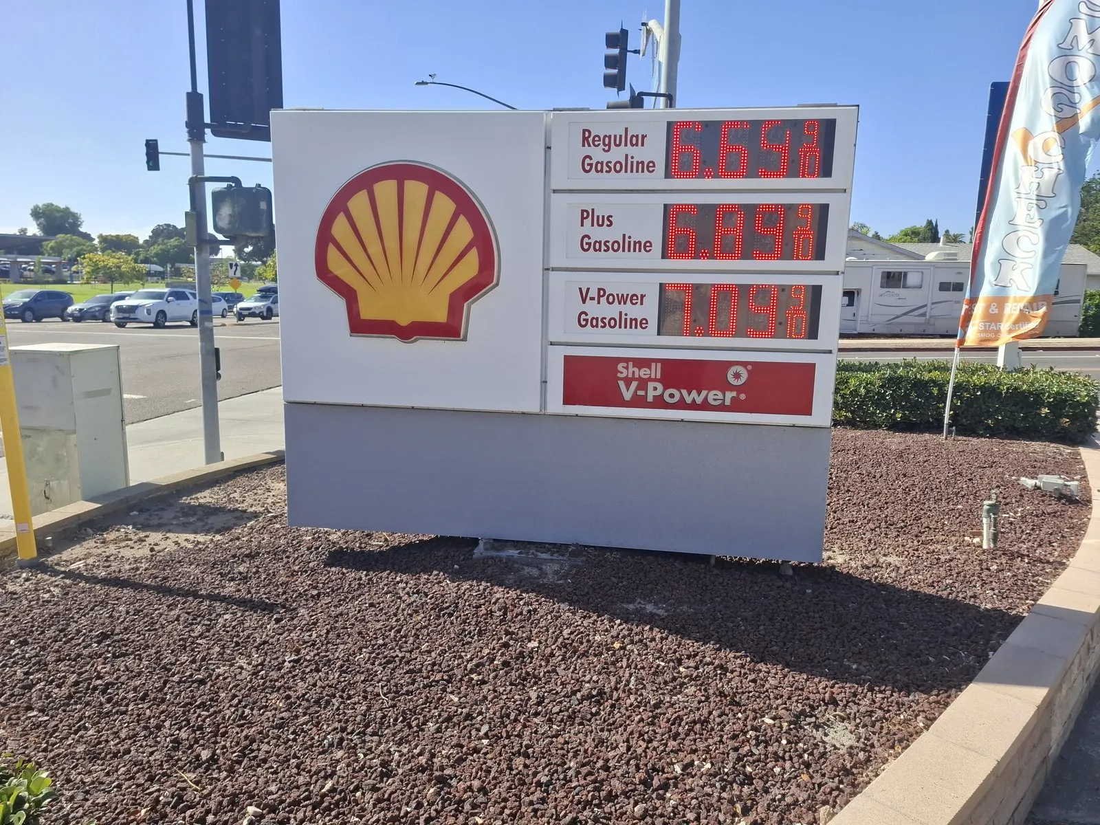 Shell station price sign in Chula Vista, California, showing regular at $6.64, plus at $6.84 and V-Power at $7.09 a gallon