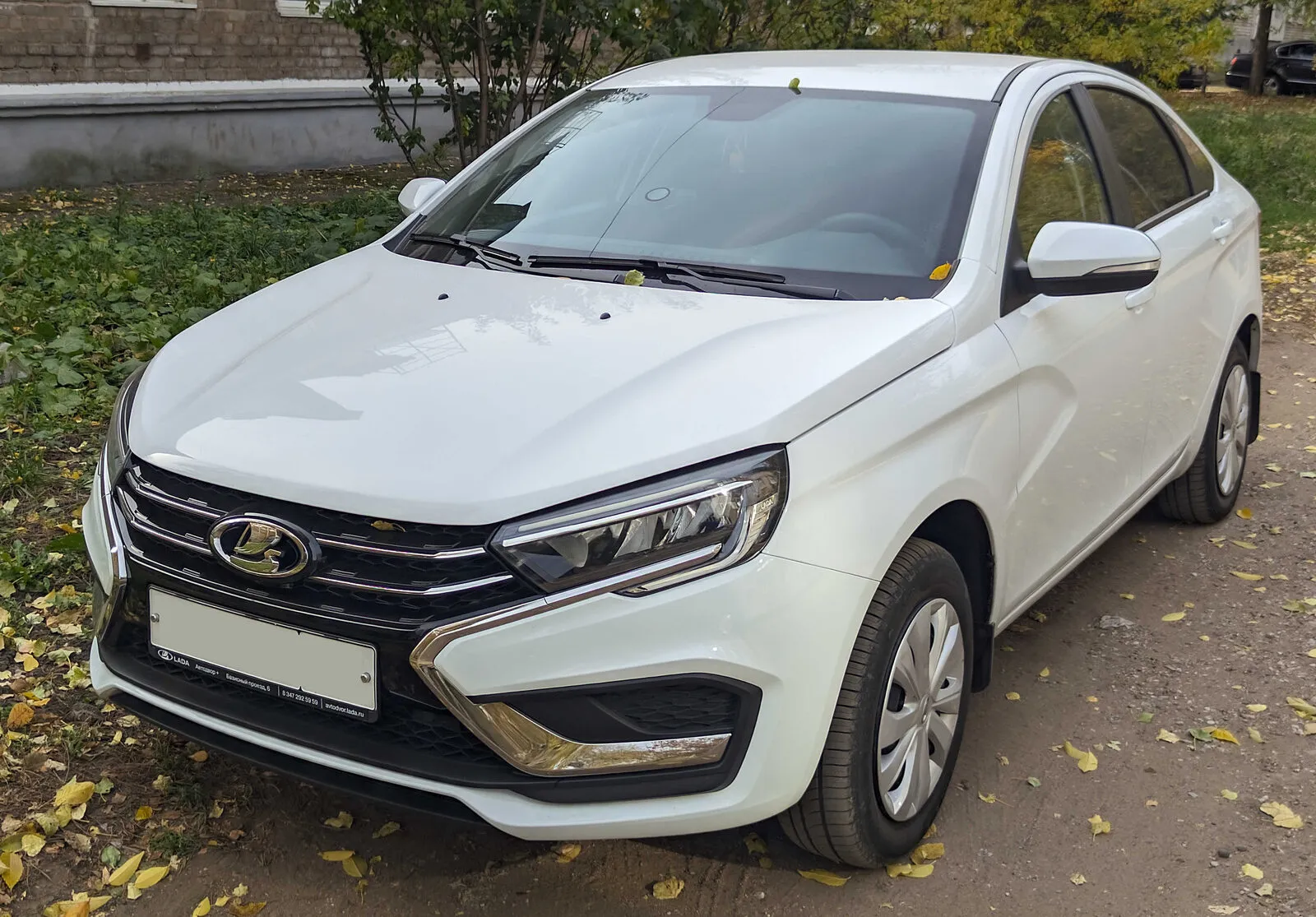 Lada Vesta sedan in white, front three-quarter view