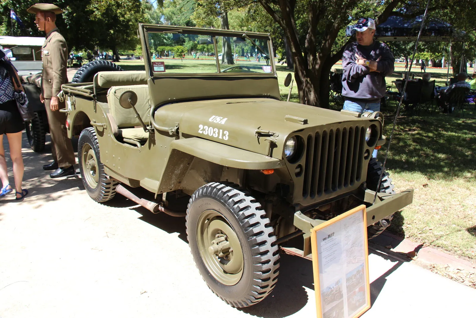 Olive-drab 1942 Willys-Overland MB jeep with folded windscreen, front three-quarter view at a show